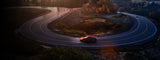 Car on windy road in the early morning